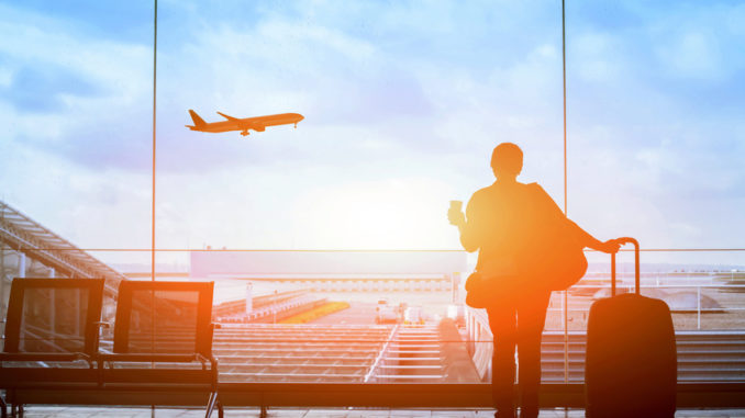 happy traveler waiting for the flight in airport, departure terminal, immigration concept