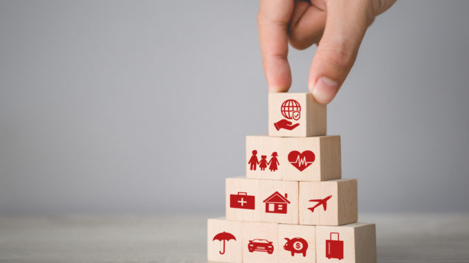 Hand,Arranging,Wood,Block,Stacking,With,Icon,Insurance:,Car,health,home,money,travel,family,insurance,Concept.