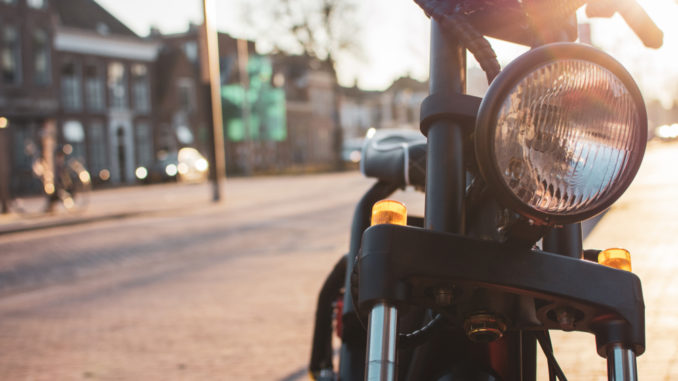 An,Electric,Moped,On,The,Sidewalk,In,The,City,,In
