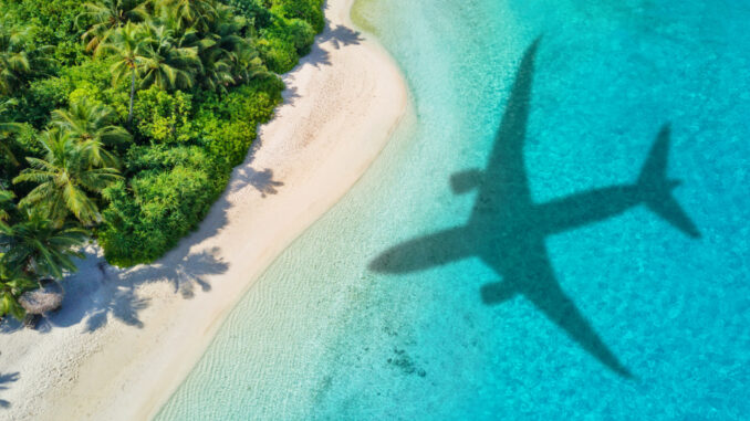 Travel,Concept,With,Airplane,Shadow,And,Tropical,Beach.,Tropical,Paradise